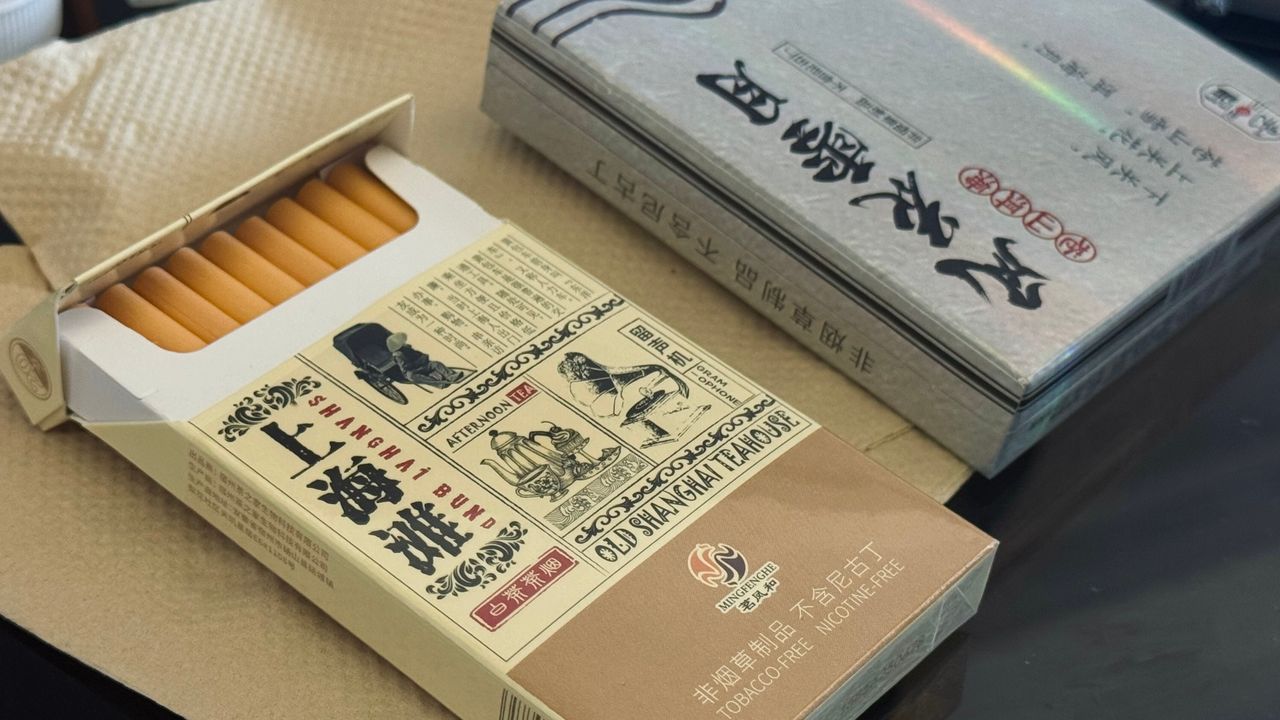 Mastering the First Impression: Your intriguing post title goes here Open box of nicotine-free teabacco with vintage Shanghai design.